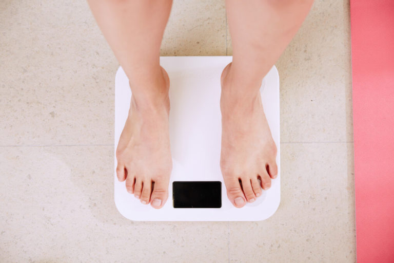 lady-standing-on-scale